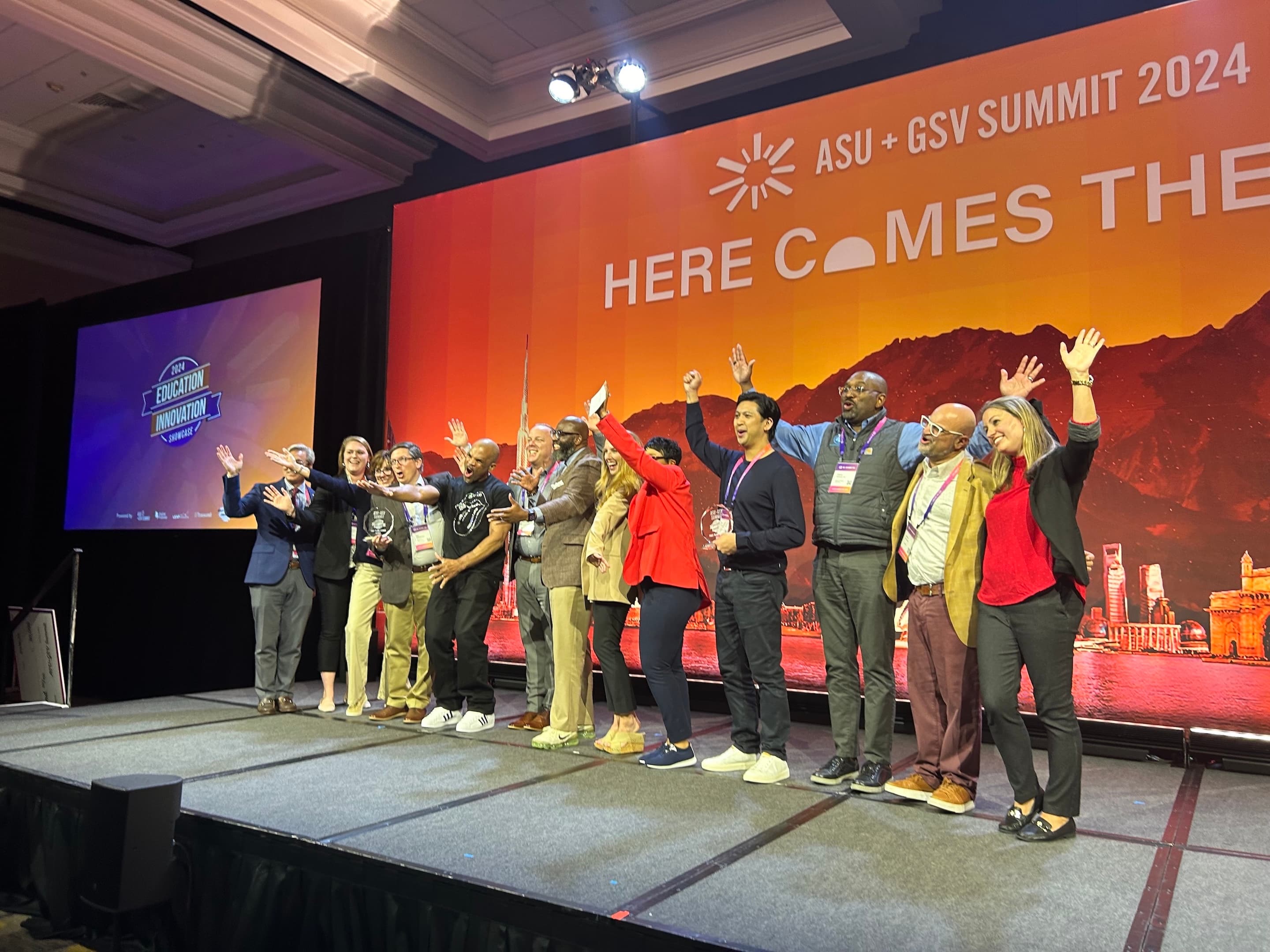 Jon Siapno on stage at ASU+GSV Summit 2024 after winning 1st place
